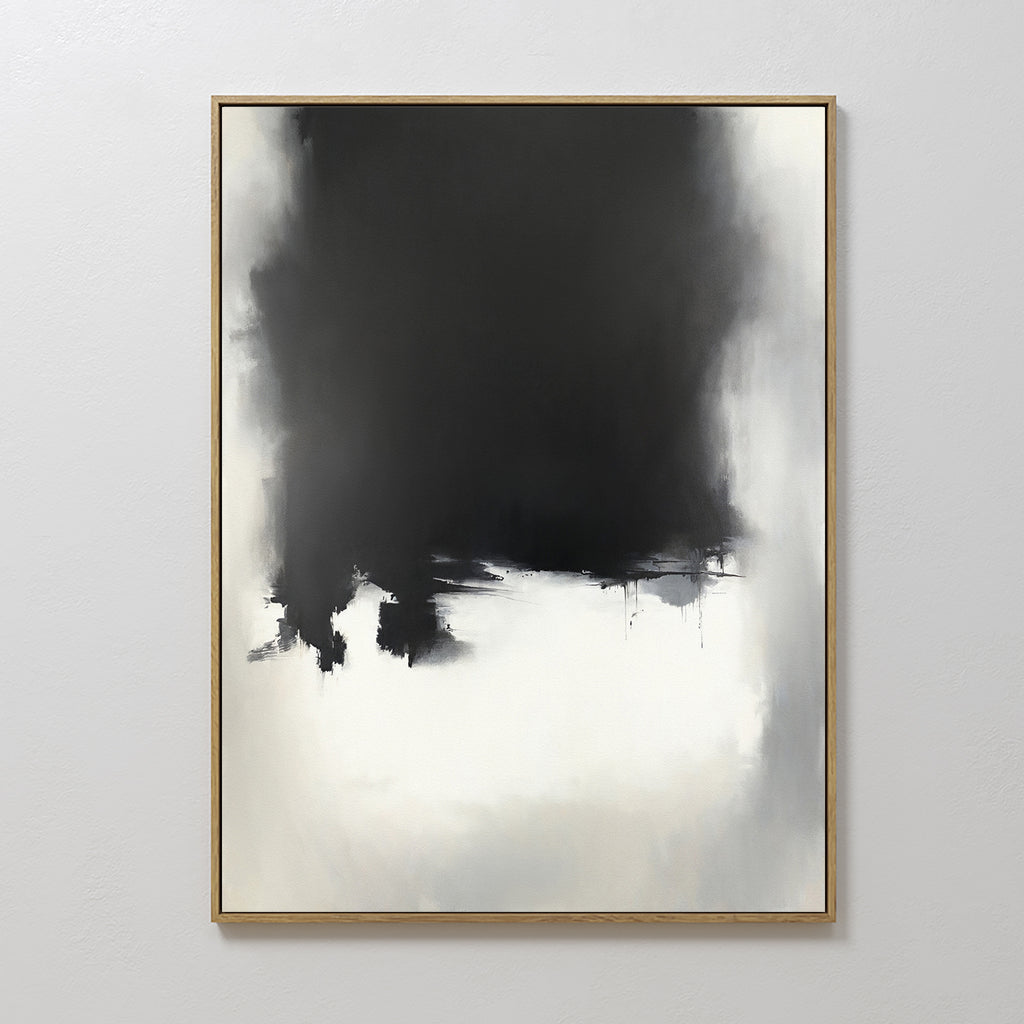 The Ink Cloud Formation Canvas Art - Vertical showcases a large, irregular black shape merging into gray and white tones on a white background. Framed in thin wood, this monochrome piece brings modern sophistication to any wall.