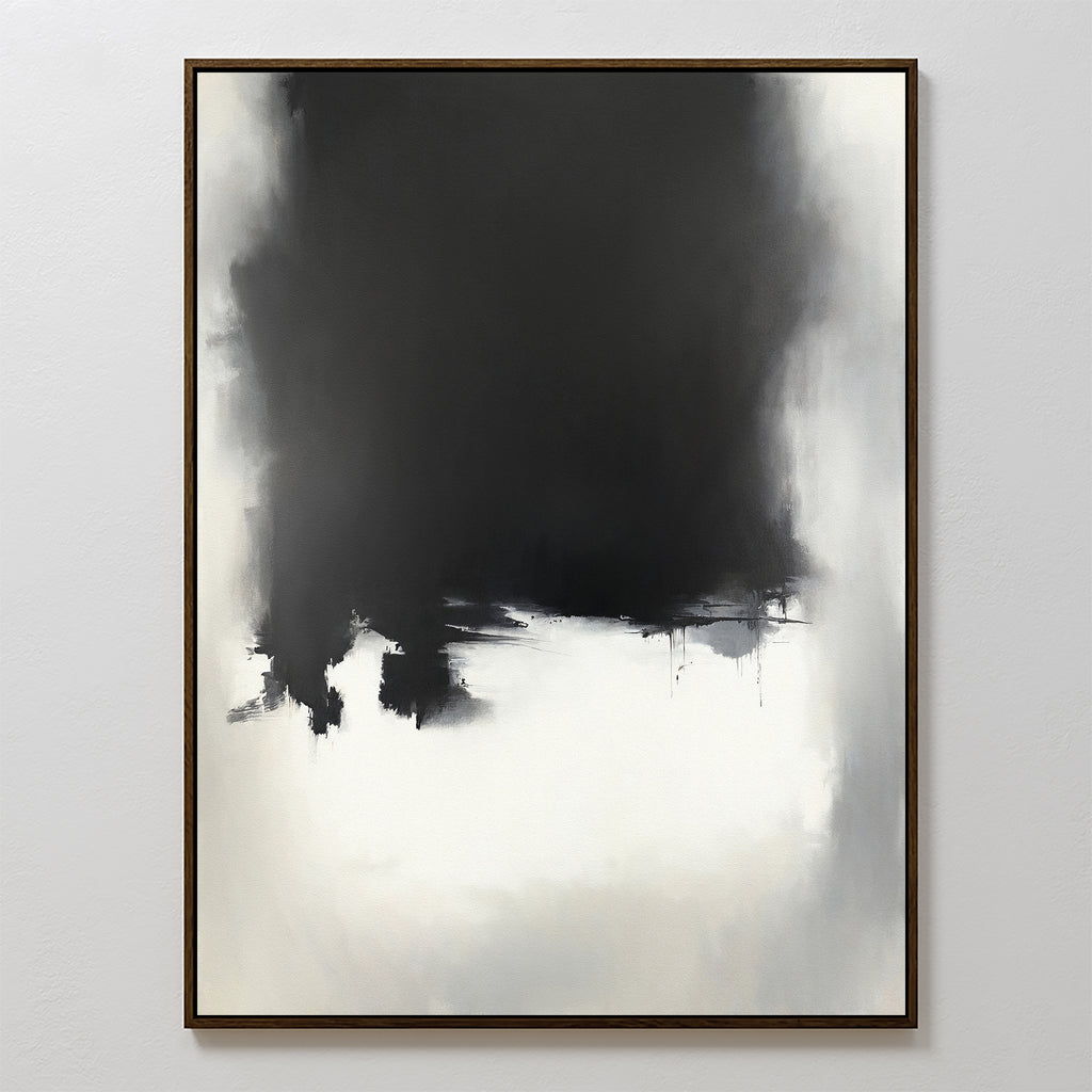 Ink Cloud Formation Canvas Art - Vertical features a large black mass at the top blending into light gray and white below, with soft edges and subtle drips. This monochrome print exudes modern sophistication in a thin, simple wooden frame.