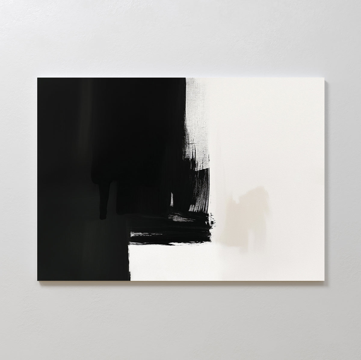 Ink Divide Canvas Art - Horizontal showcases bold black brushstrokes fading into white, accented with beige and gray at the center. This modern, minimalist piece exudes elegance and is displayed on a light-colored wall.