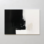Ink Divide Canvas Art - Horizontal showcases bold black brushstrokes fading into white, accented with beige and gray at the center. This modern, minimalist piece exudes elegance and is displayed on a light-colored wall.