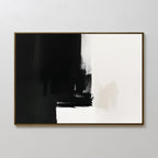 The Ink Divide Canvas Art - Horizontal showcases contemporary wall art with bold black brushstrokes on the left, white on the right, and a textured blend at the center where both colors meet.