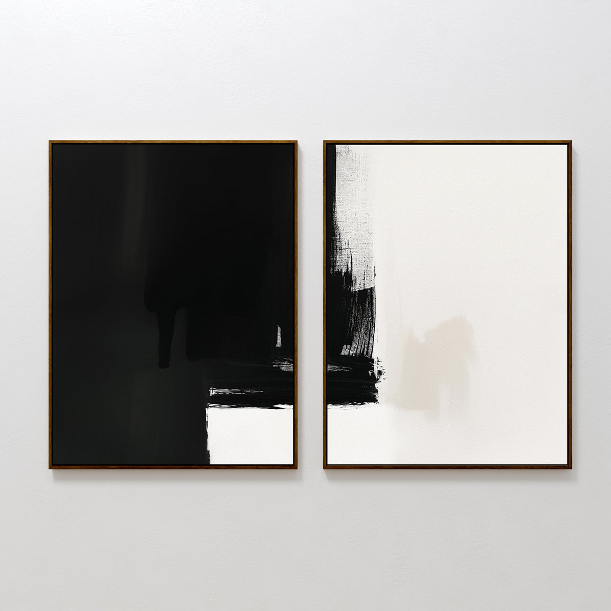 Ink Divide - Set Of 2 features two adjacent framed abstract pieces: one mainly black with a white edge, the other mostly white with bold black brushstrokes. Both artworks exude modern elegance and a contemporary wall art style.