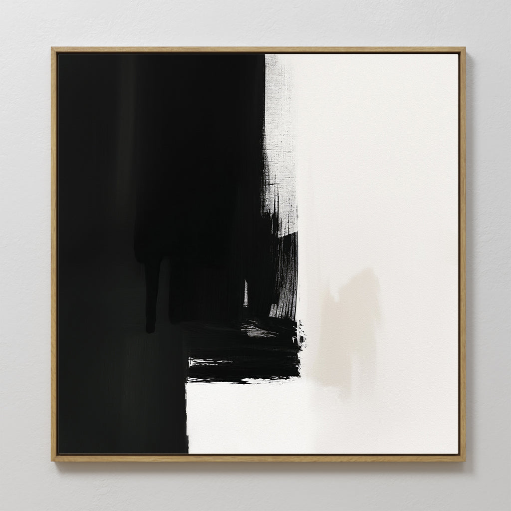 The Ink Divide Canvas Art - Square features bold black and white sections with textured brushstrokes. Predominantly black on the left and white on the right, this contemporary wall art creates a striking visual contrast.