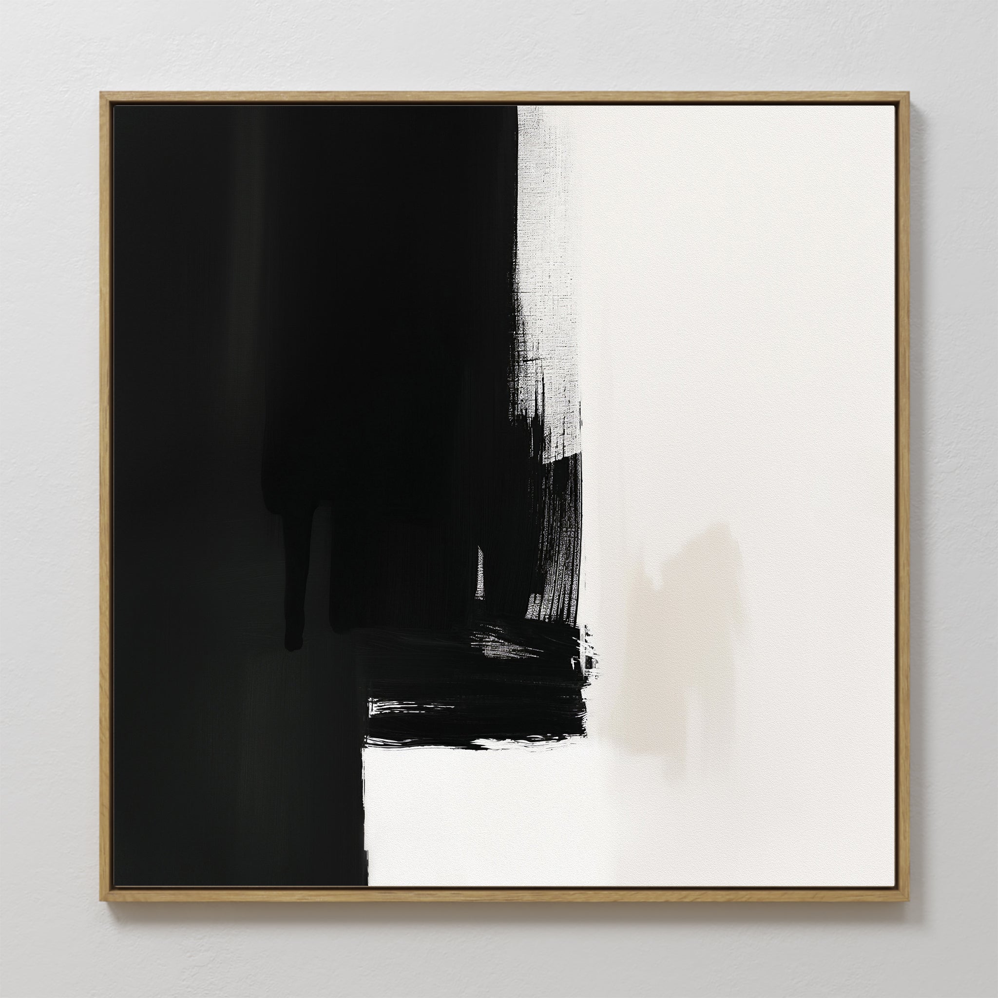The Ink Divide Canvas Art - Square features bold black and white sections with textured brushstrokes. Predominantly black on the left and white on the right, this contemporary wall art creates a striking visual contrast.