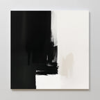 Ink Divide Canvas Art - Square features bold black brushstrokes on the left fading into textured white on the right, offering high-contrast, minimalist wall art that elevates your space with contemporary elegance.