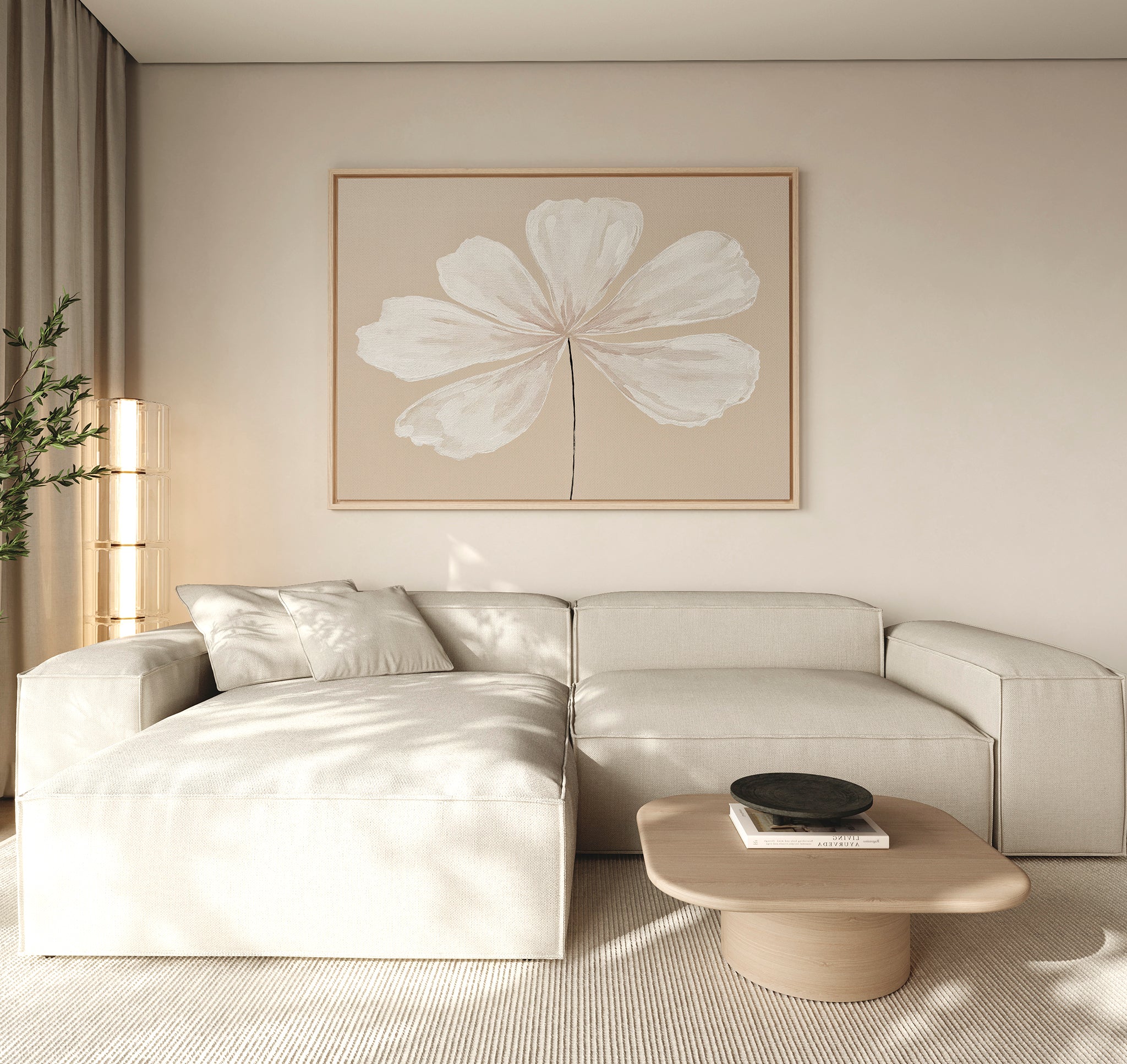 A modern living room with a light beige sectional sofa, minimalist light wood coffee table with a black bowl, neutral rug, tall plant, and the Ivory Bloom Canvas Art - Horizontal as neutral wall decor above the seating area.