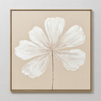 The Ivory Bloom Canvas Art - Square showcases a white six-petaled flower with a black stem on a beige background, framed in thin wood—ideal minimalist botanical wall art for neutral home decor.