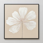 Ivory Bloom Canvas Art - Square: A minimalist canvas print featuring a single white flower with six petals and a black stem on beige, framed in black—ideal botanical wall art for neutral home decor.
