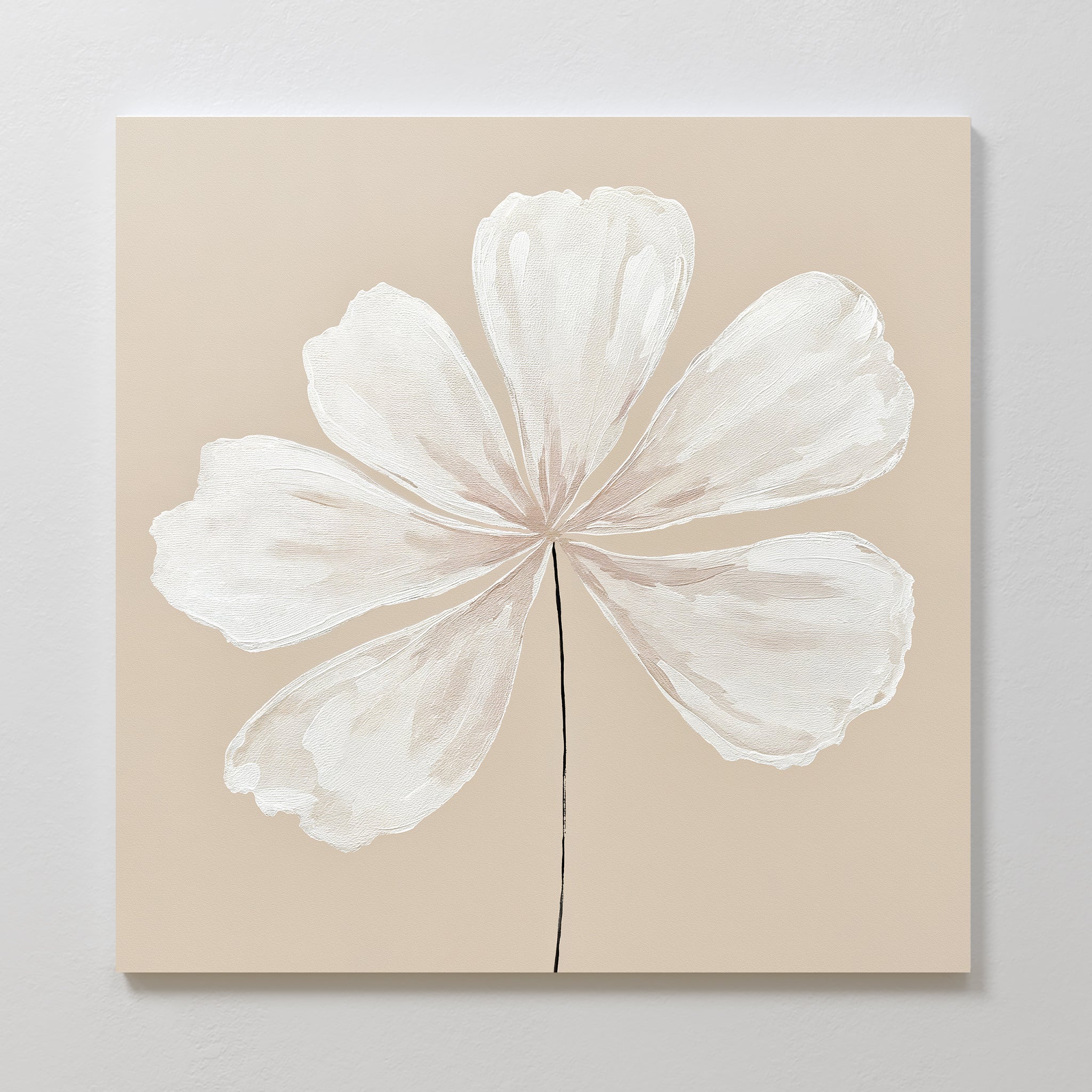 The Ivory Bloom Canvas Art - Square showcases a large white six-petal flower on a beige background, offering minimalist botanical wall art ideal for neutral home decor.