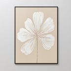 “Ivory Bloom Canvas Art - Vertical” features a six-petal white flower with a black stem on beige, framed in black for elegant botanical style—perfect for adding minimalist charm to neutral home decor on light walls.