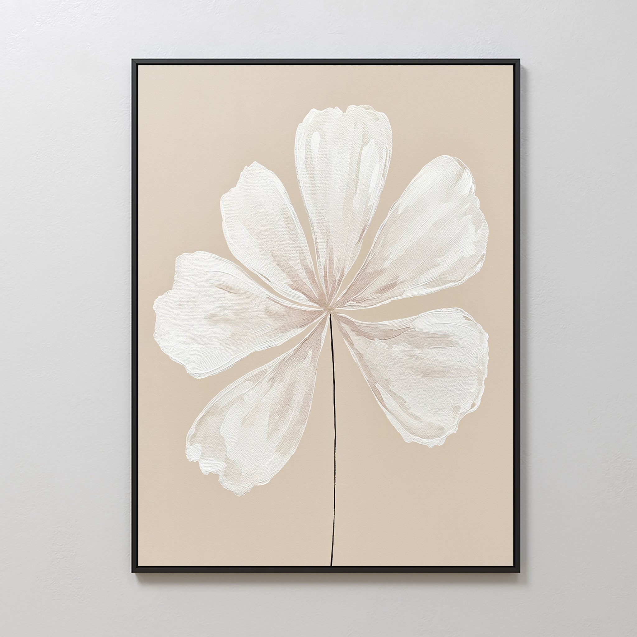 “Ivory Bloom Canvas Art - Vertical” features a six-petal white flower with a black stem on beige, framed in black for elegant botanical style—perfect for adding minimalist charm to neutral home decor on light walls.