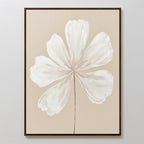 The Ivory Bloom Canvas Art - Vertical showcases a large white abstract six-petal flower on a beige background in a slim dark frame, adding subtle elegance to any neutral home décor.