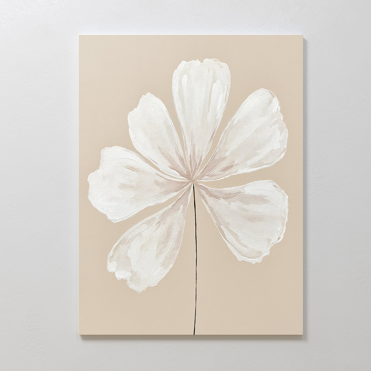 Ivory Bloom Canvas Art - Vertical: A minimalist canvas featuring a single off-white six-petal flower with a slim black stem on a beige background, perfect for neutral home decor and ideal for display on light-colored walls.
