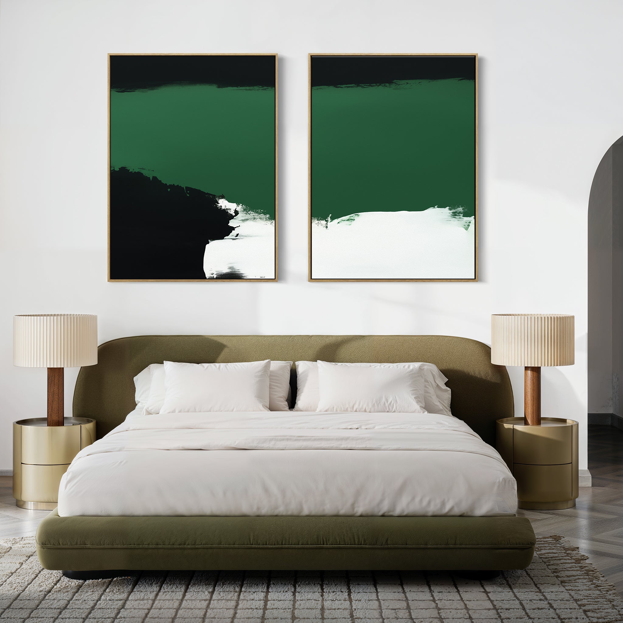A modern bedroom with a green upholstered bed, white bedding, two beige nightstands with matching lamps, and Jade Depths - Set Of 2 emerald green contemporary prints above the bed on a crisp white wall.