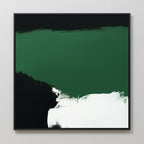 The Jade Depths Canvas Art - Square features a bold emerald green top section, a black area on the left, and white brushstrokes at the bottom. This contemporary print comes in a slim black frame and is displayed against a light gray wall.