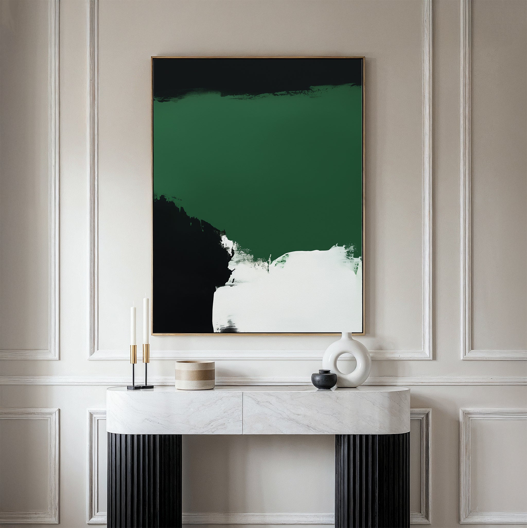 A modern console table with a white marble top holds minimalist decor beneath the Jade Depths Canvas Art - Vertical, an abstract emerald green print, set against a light-paneled wall—perfect for contemporary living room decor.