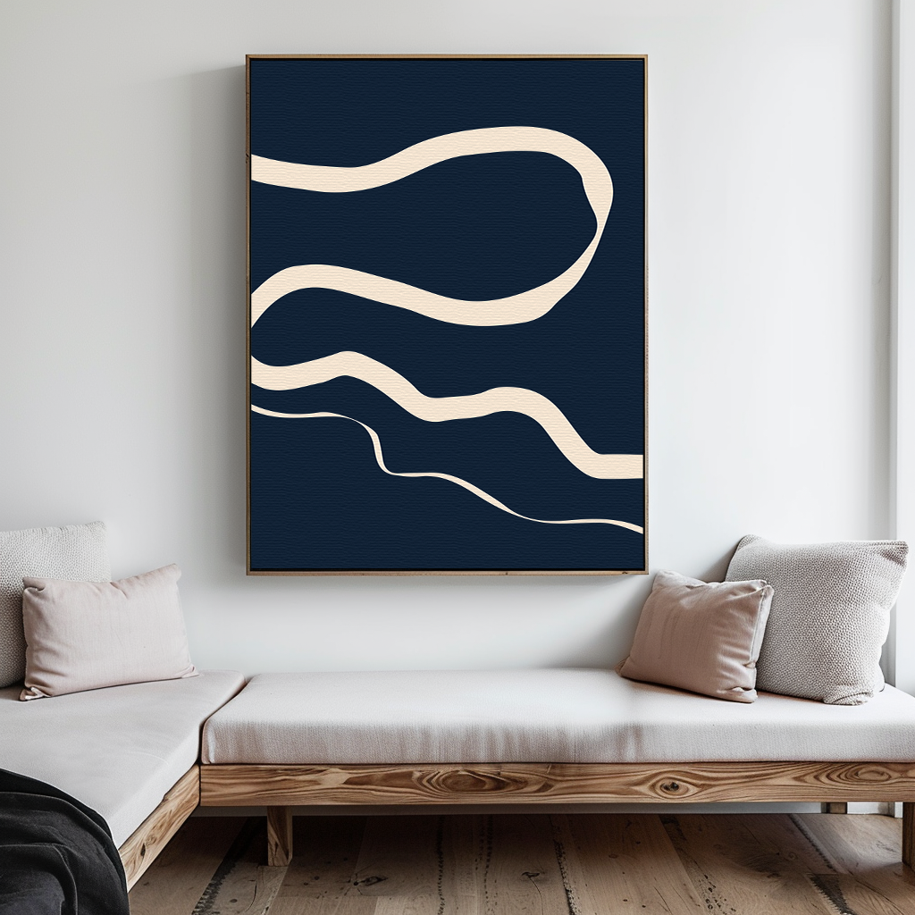 A modern living room with light wood sofas and beige cushions is elevated by the Blue Tranquility Abstract Canvas Art—featuring cream wavy lines on a dark blue background—displayed on a crisp white wall.