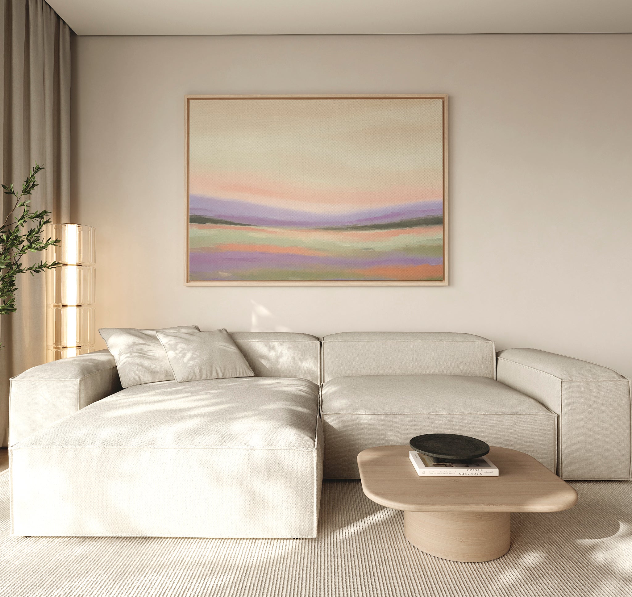 A modern living room with a light beige sectional sofa, a light wood coffee table, and the Lavender Valley Canvas Art - Horizontal on the wall. Soft natural light filters through sheer curtains, and a tall plant sits in the corner.