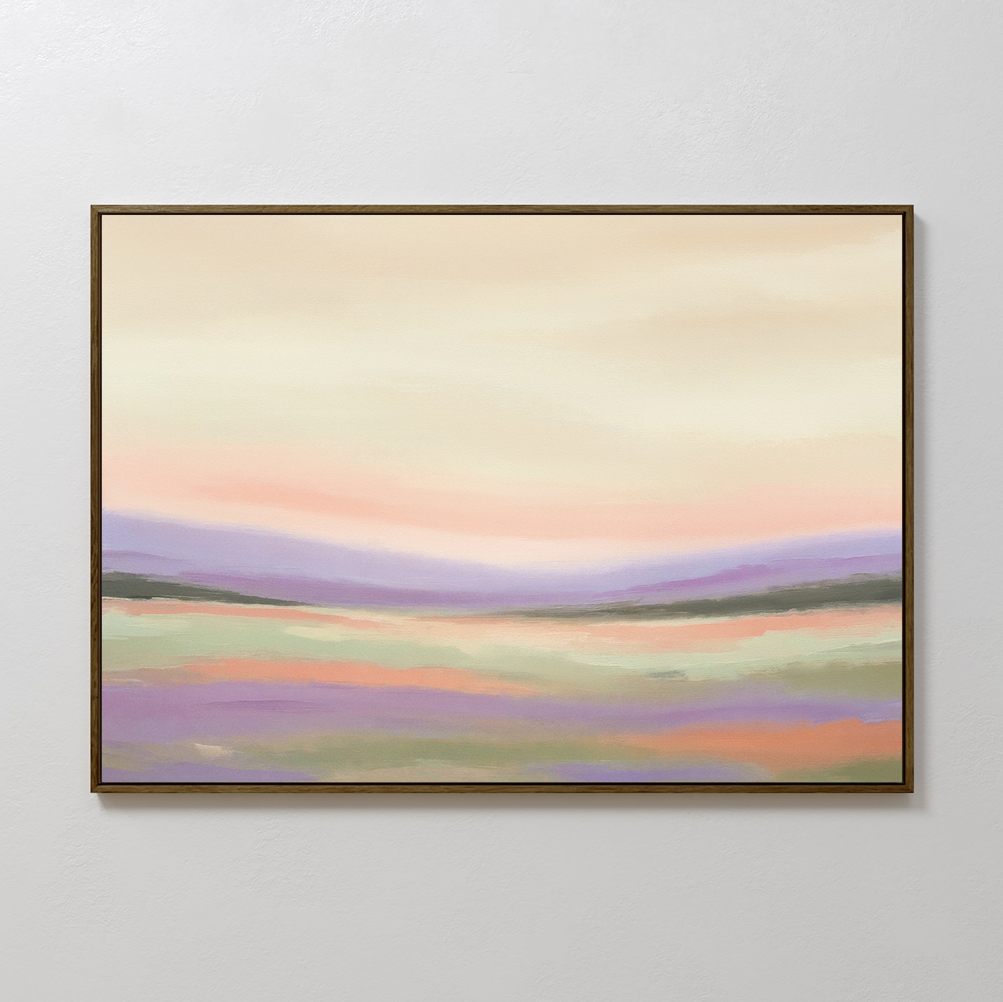 The Lavender Valley Canvas Art - Horizontal features a framed abstract landscape in pastel shades of purple, green, peach, and cream with rolling hills beneath a cloudy sky—perfect serene wall art for any space.