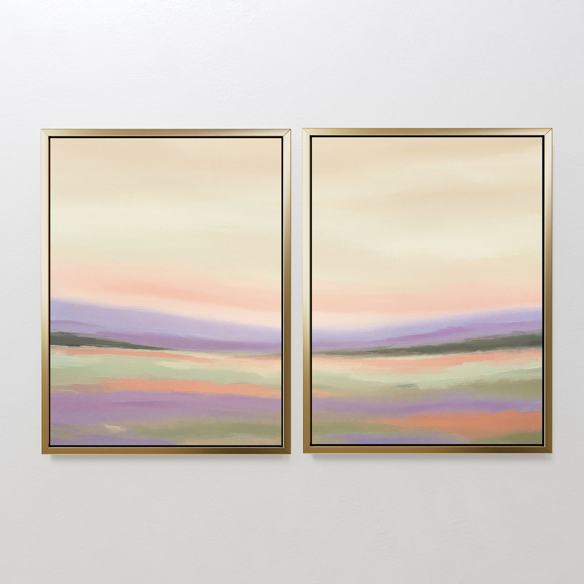 The "Lavender Valley - Set Of 2" features framed abstract landscape paintings with soft pastel shades of pink, purple, green, and beige, depicting rolling hills under a calm sky—perfect serene wall art for any white wall.