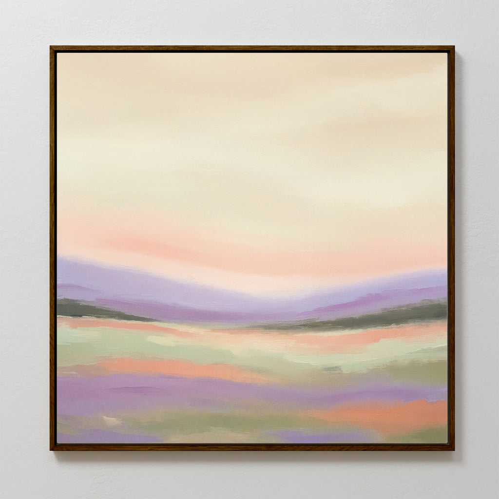 Lavender Valley Canvas Art - Square features a framed abstract landscape in soft pastel shades of purple, pink, peach, and green with gentle brushstrokes—perfect as tranquil and dreamy wall art for any space.