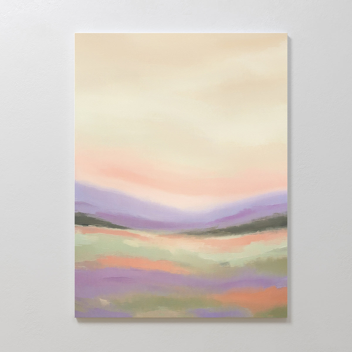 The Lavender Valley Canvas Art - Vertical features a pastel landscape of gentle lavender, peach, and green hills beneath a warm sky, creating a soft, serene scene perfect for hanging on a white wall.