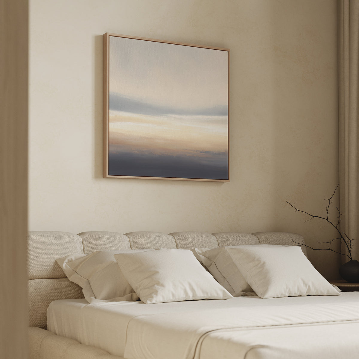 A softly lit bedroom features a beige upholstered bed with white pillows and bedding. Above hangs the Layered Dusk Canvas Art - Square, its neutral abstract tones adding Nordic Park tranquility beside floor-length curtains and a bare branch.