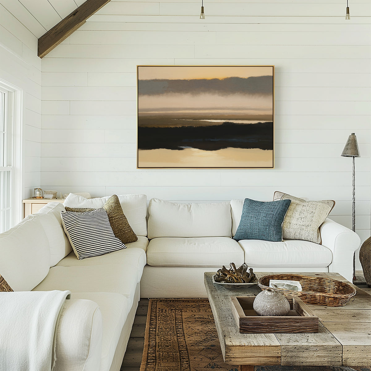 A bright, cozy living room with a white sectional sofa, textured throw pillows, a rustic wooden coffee table, and serene decor featuring the Layered Valley Dawn Canvas Art - Horizontal as wall art on a white shiplap wall.