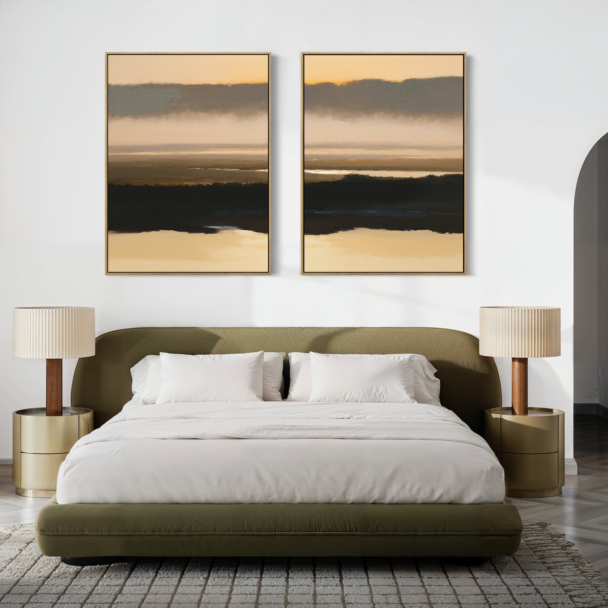 A modern bedroom features an olive green upholstered bed with white bedding, two beige nightstands and matching lamps, and "Layered Valley Dawn - Set Of 2" large abstract landscape art above the bed for a tranquil, minimalist vibe.