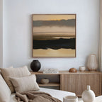 A minimalist living room features a beige sofa, wooden sideboard with vases and books, and the Layered Valley Dawn Canvas Art - Square depicting an abstract landscape hanging on a white wall. Natural light streams in through curtained windows.