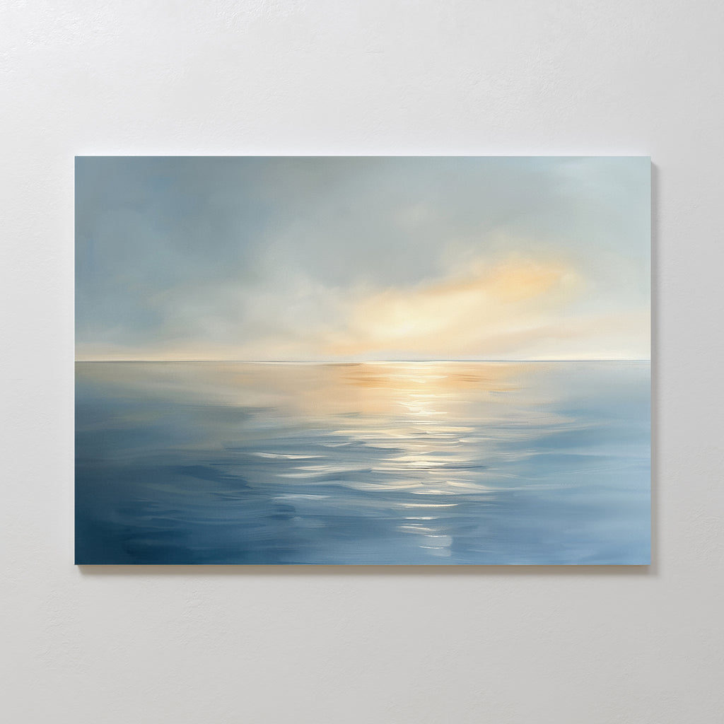 The Luminous Calm Canvas Art - Horizontal depicts a tranquil sea beneath a cloudy sky, with soft sunlight on the water. Its blend of cool blues and warm golds creates a peaceful, serene atmosphere for any space.