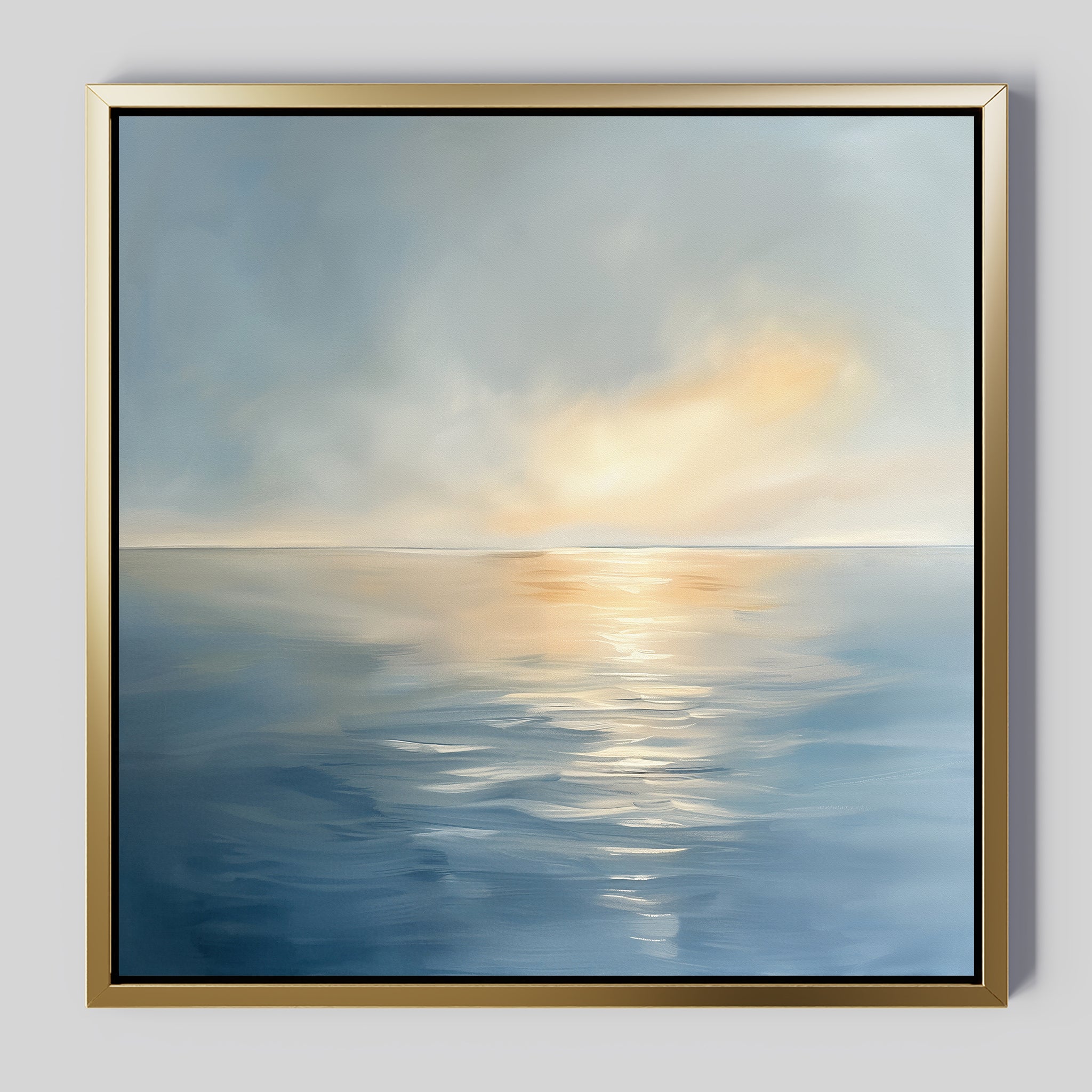 The Luminous Calm Canvas Art - Square features a tranquil sea beneath a cloudy sky, with soft sunlight on the water and a soothing palette of blues, grays, and golds to create a serene, peaceful atmosphere.