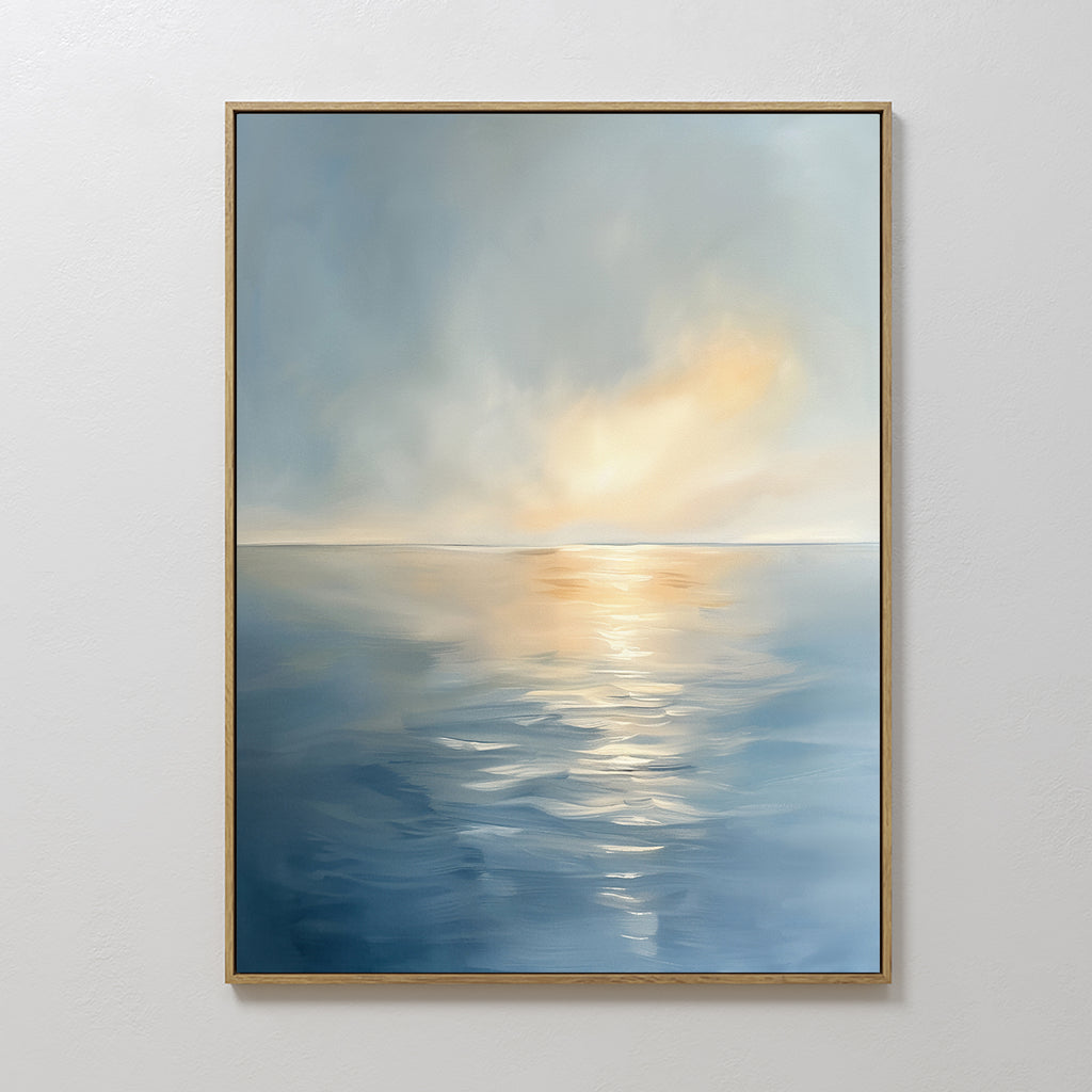 The Luminous Calm Canvas Art - Vertical features a framed print of a calm ocean with gentle waves and soft sunlight, blending blue and golden tones for a Nordic Park-inspired tranquility in your space.