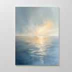 The Luminous Calm Canvas Art - Vertical features a tranquil ocean in soft blue and gray hues, illuminated by a glowing sunset or sunrise, creating a serene coastal vibe that looks stunning on any white wall.