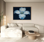 A modern living room features a beige sectional sofa, a light wood coffee table, and the Luminous Iris Canvas Art - Horizontal as striking wall art above the sofa. Neutral tones and minimalist décor enhance the serene ambiance.