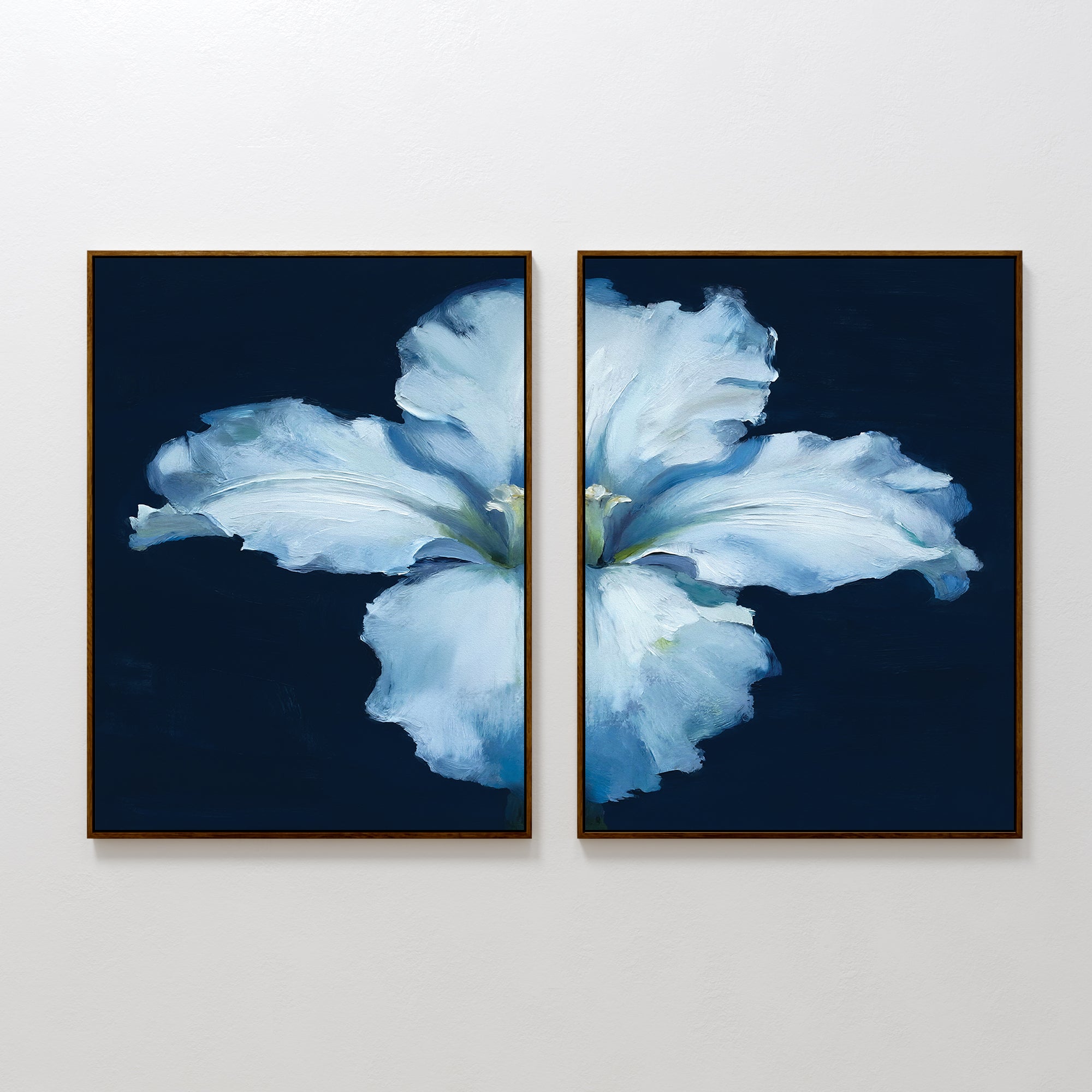 The Luminous Iris - Set of 2 features two framed canvas prints that together form a radiant iris with soft petals on a dark blue background, ideal for adding cohesion to any Nordic Park-inspired decor.
