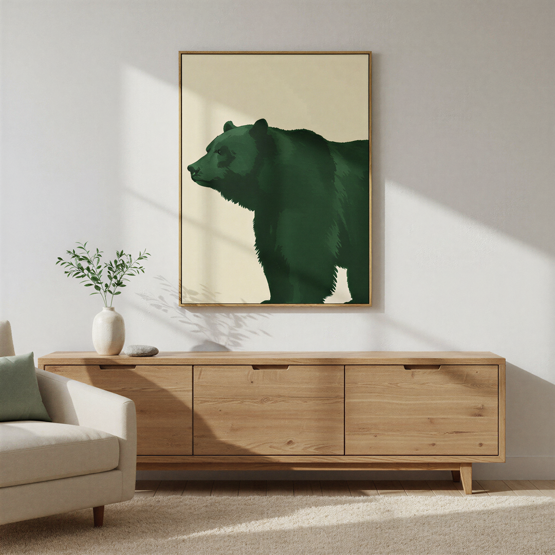 A minimal living room with a light sofa, wooden sideboard, small potted plant, and the Forest Guardian Canvas Art adds a touch of personality with striking green bear imagery.