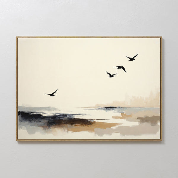Maritime Flight Canvas Art - Horizontal: Minimalist coastal piece with four black bird silhouettes soaring above a tranquil seascape in beige, gray, and brown hues, set in a natural wood frame on a white wall.