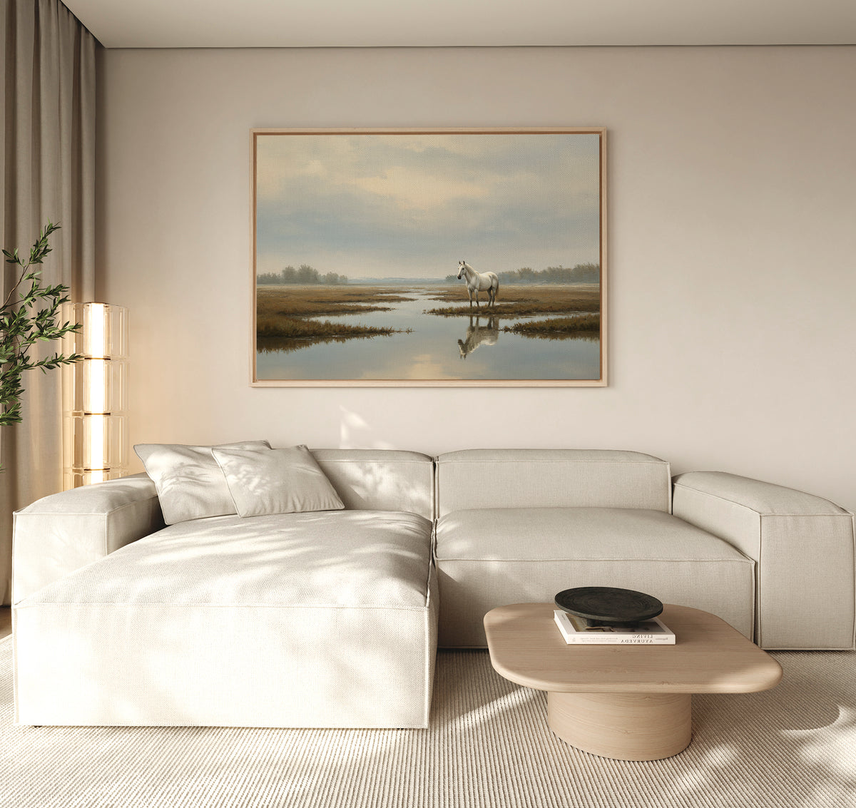 A modern living room features a light beige sectional sofa, a low wooden coffee table, and the Marsh Reflection Canvas Art - Horizontal above a calm water scene. Neutral, Nordic Park-inspired decor adds to the serene, minimalistic atmosphere.