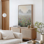 A modern living room features a light wooden sideboard with a vase, books, and the Meadow Dreams Canvas Art - Vertical above it. A white sofa, minimalist decor, and a leafy plant complete the serene space inspired by Nordic Park.