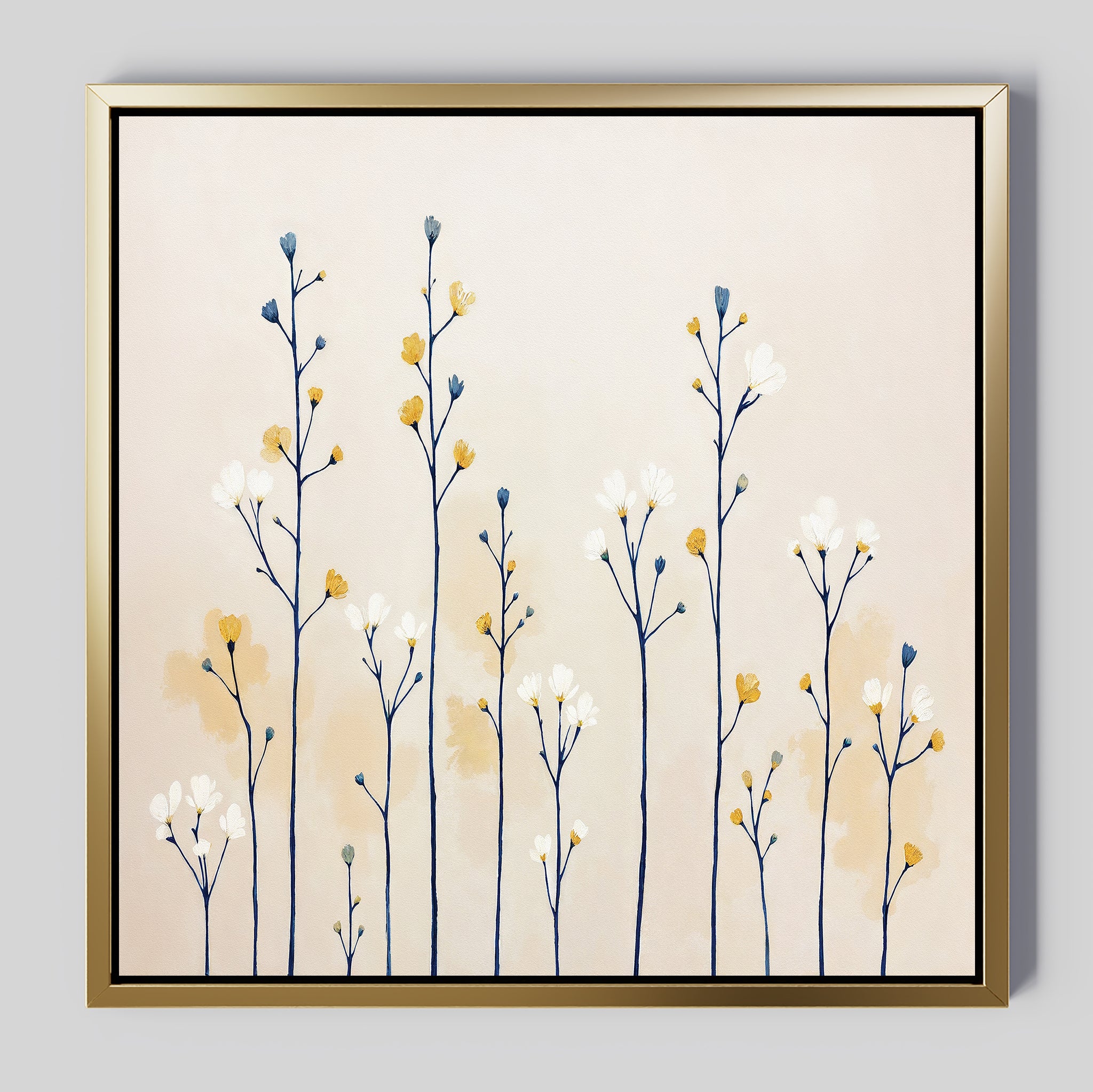 The Meadow Symphony Canvas Art - Square features tall, thin flower stems with white and yellow blossoms on a light beige backdrop in a gold frame. This minimalist wildflowers wall art adds a soft, modern botanical touch—ideal spring meadow decor for any space.