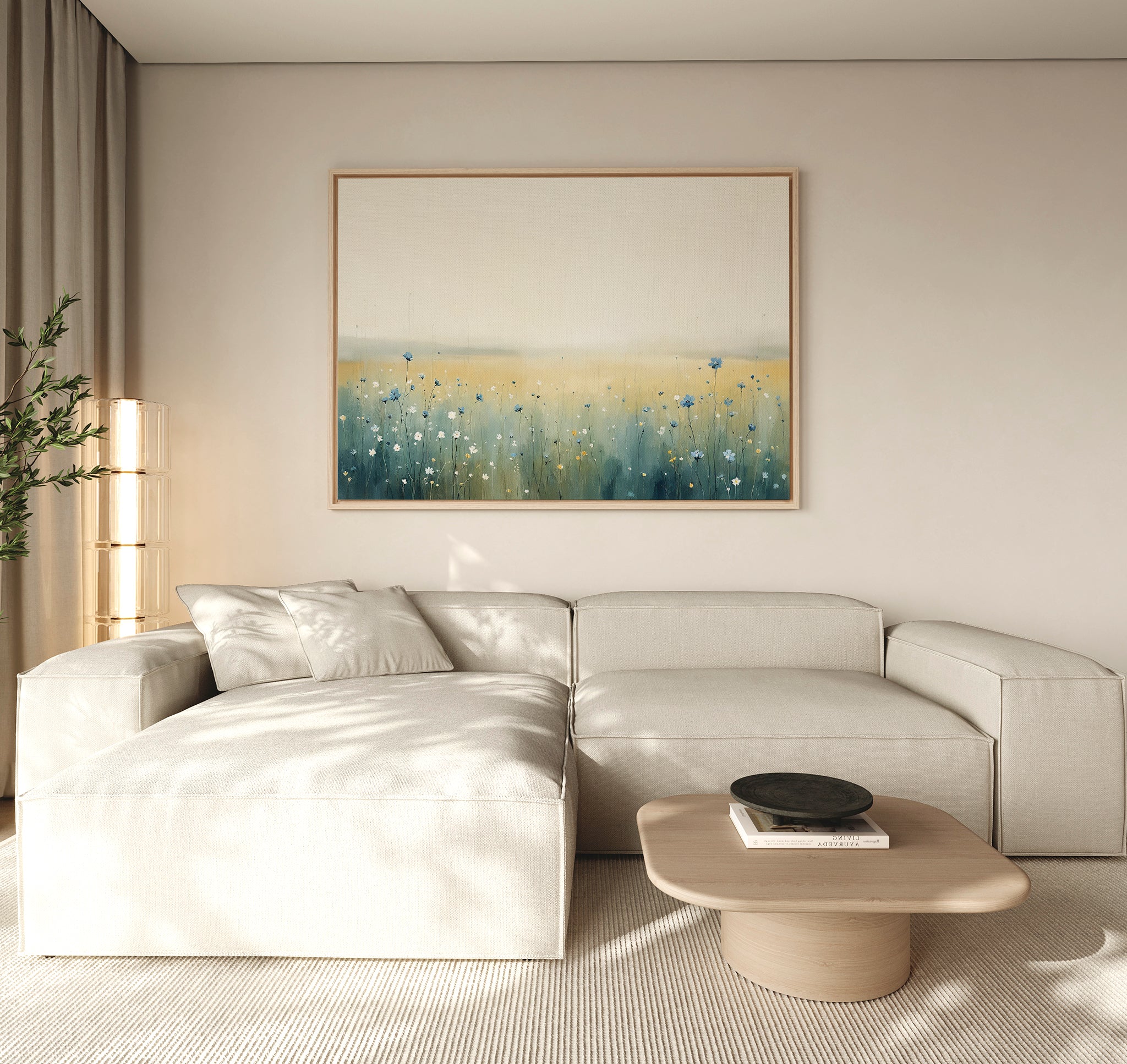 A modern living room featuring a light beige sectional sofa, wooden coffee table, and the Meadow Whispers Canvas Art - Horizontal on the wall, accented by a tall plant and neutral-toned decor.