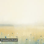 Meadow Whispers Canvas Art - Square features a minimalist watercolor of a pale yellow field with blue and white wildflowers and a soft, cloudy sky. "Zoomed In Detail" appears in the lower left corner.