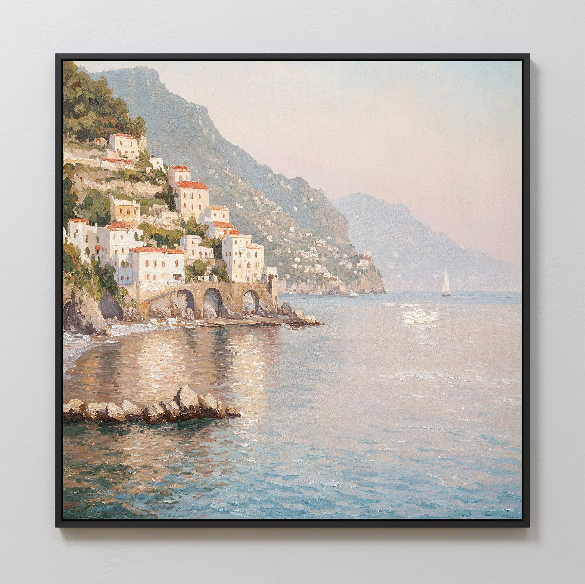 The Mediterranean Dreams Canvas Art - Square features a coastal village with white buildings, red roofs, arches by the water, a distant sailboat, and a shimmering blue sea—perfect for peaceful home decor.