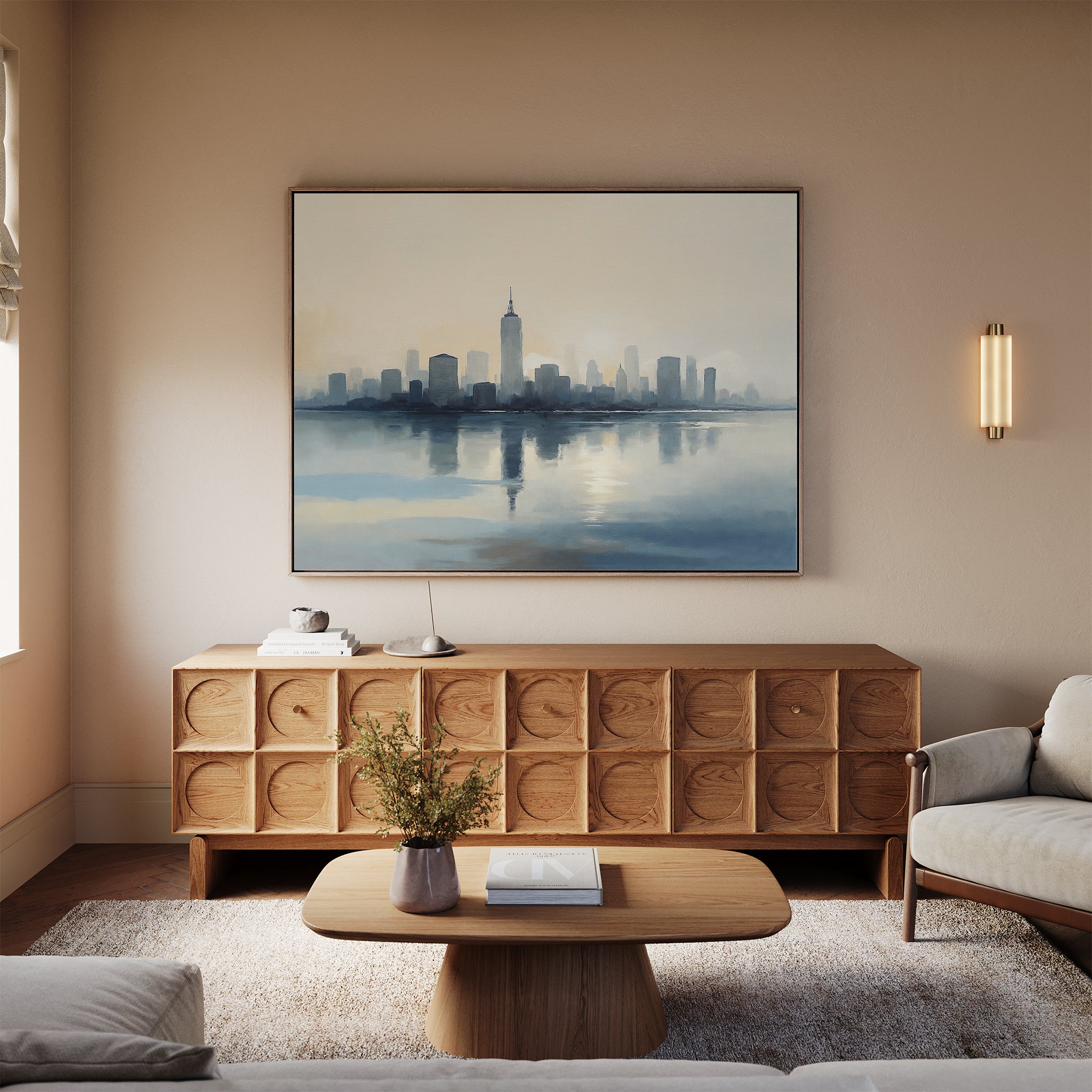 A modern living room with light beige walls showcases the Metropolitan Dawn Canvas Art - Horizontal above a wooden sideboard, complemented by a coffee table with a vase and a light sofa on a textured rug, as soft sunlight enters from the left.