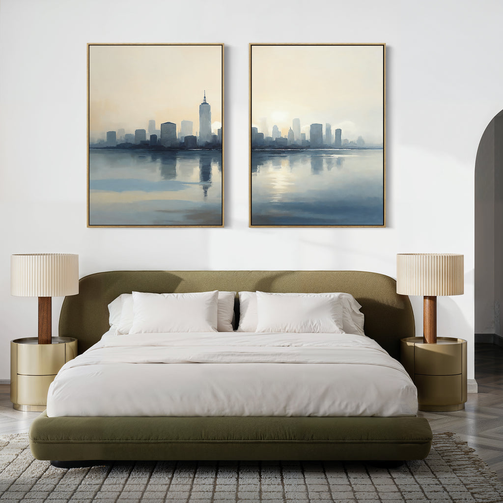 A modern bedroom features a green upholstered bed, white bedding, beige nightstands with matching lamps, and the Metropolitan Dawn - Set of 2 canvas prints above the bed for urban tranquility. A light patterned rug completes this serene city-inspired space.
