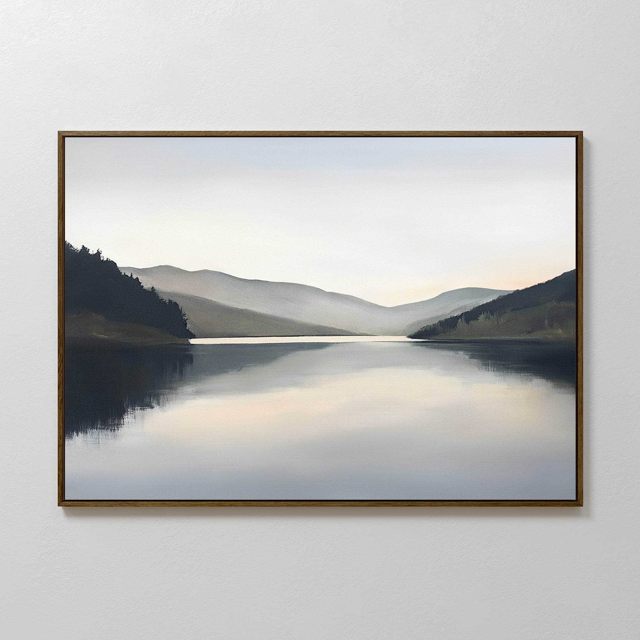 The Mirror Valley Canvas Art - Horizontal features a serene lake with gentle reflections, dark hills, and distant mountains under an overcast sky, adding a calming natural touch as Nordic Park wall art to any plain white wall.