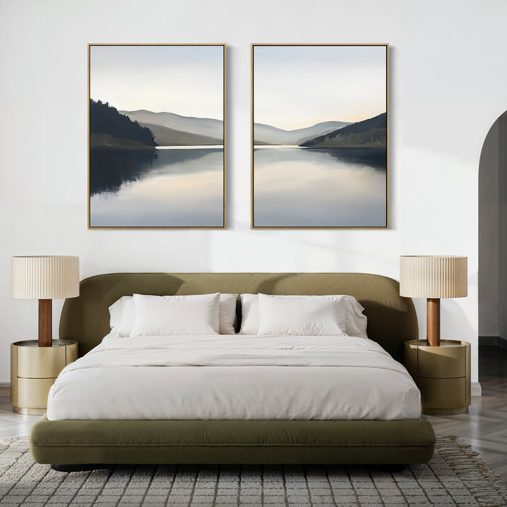 A modern bedroom with a green upholstered bed, white bedding, two round gold nightstands with beige lamps, and the Mirror Valley - Set of 2 canvas prints featuring serene lakes and mountains hung above the bed.