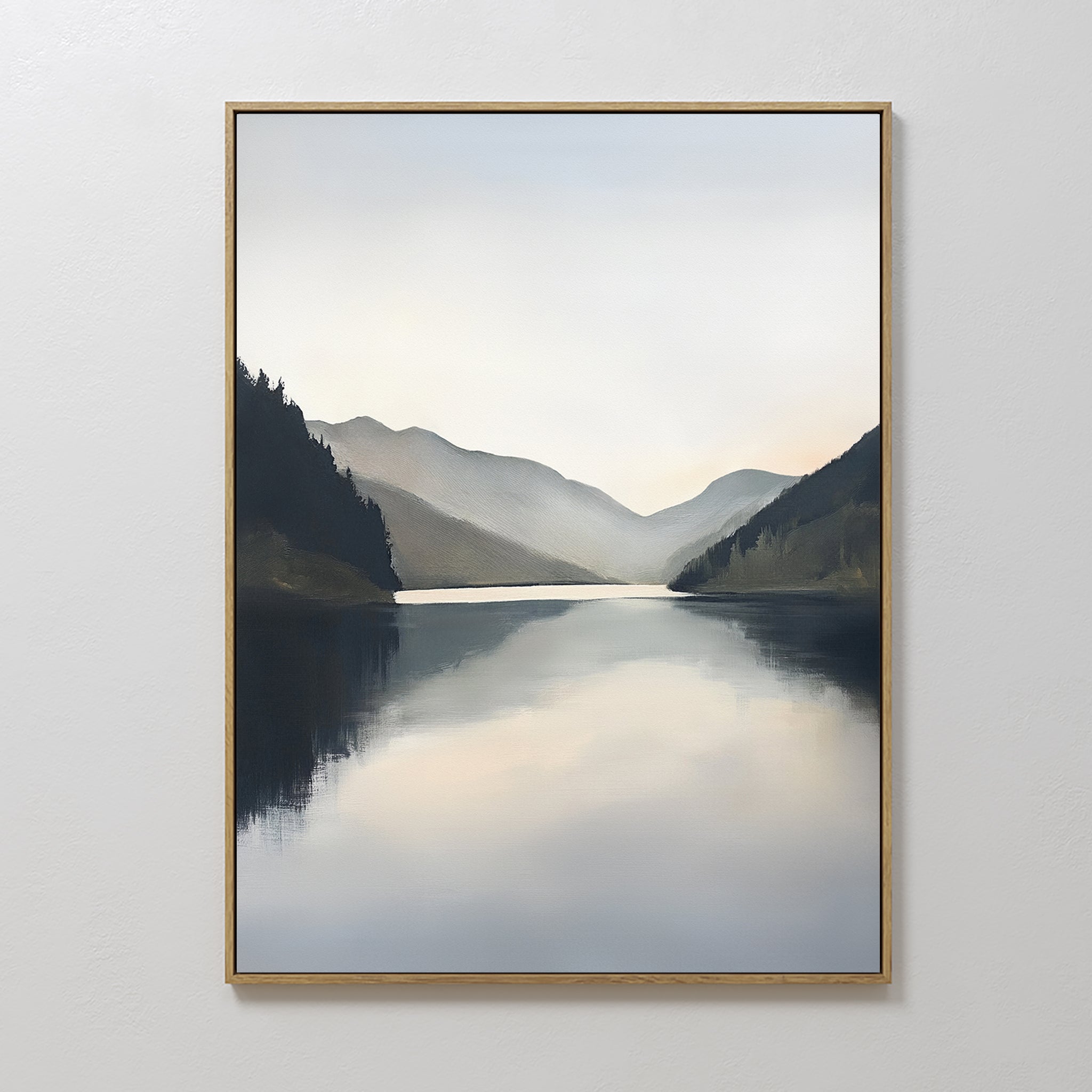 The Mirror Valley Canvas Art - Vertical features a calm lake amid dark, misty mountains under a cloudy sky, adding serene Nordic style and elegance to any plain white wall.