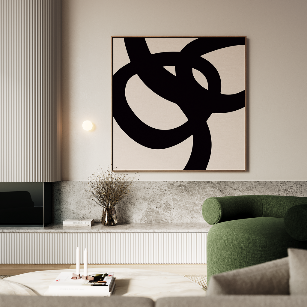 A modern living room exudes elegance with a green curved armchair, marble-topped console, vase of dried branches, and minimalist wall art—a Monochrome Stream Abstract Canvas Art above the console.